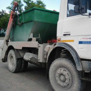 Вывоз мусора бункером. лодочкой